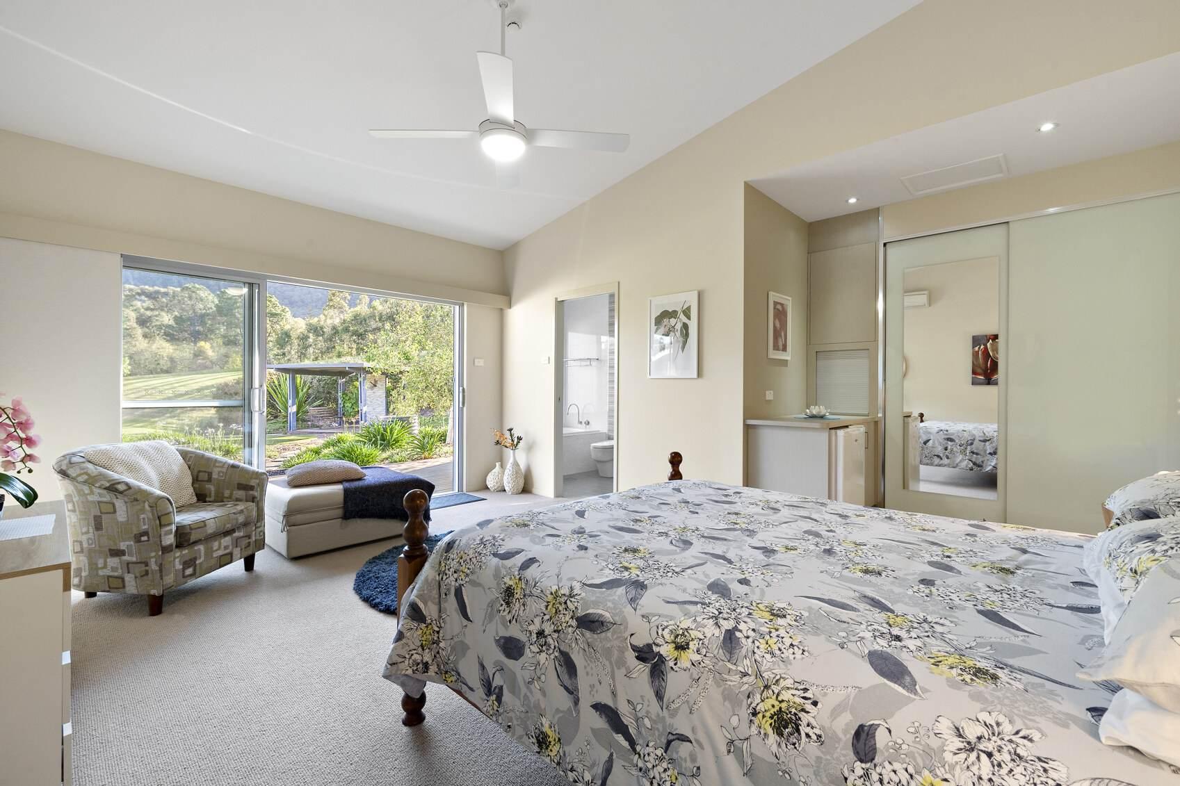 All three bedrooms in this rural property for sale NSW feature ensuites, built-in robes, and private decks
