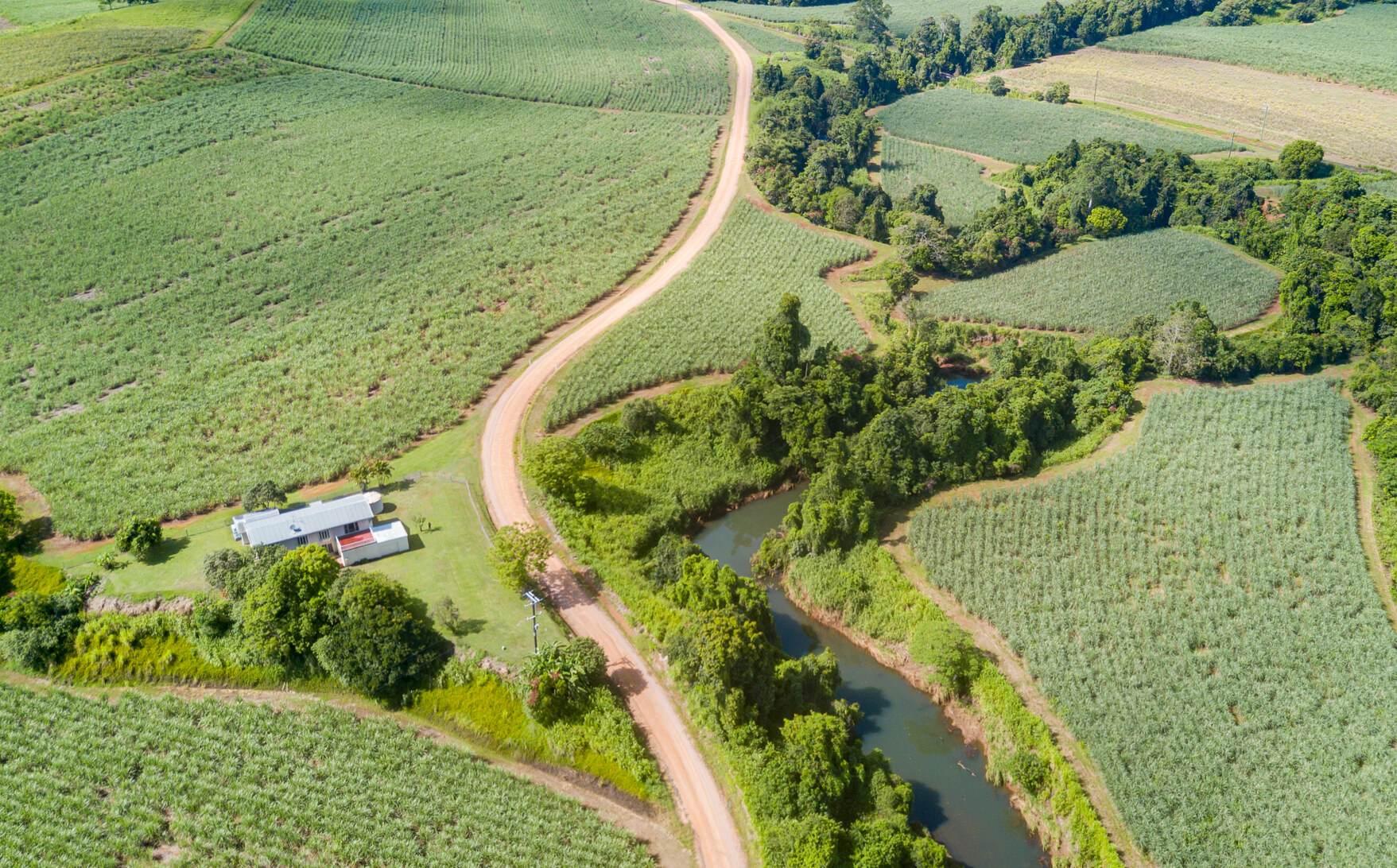 This rural property for sale North QLD also has a current water licence for extra irrigation if needed. There are 2 large farm sheds with some farming equipment.